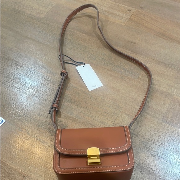Mango Handbags - NWT Mango Crossbody Bag. Strap is adjustable.